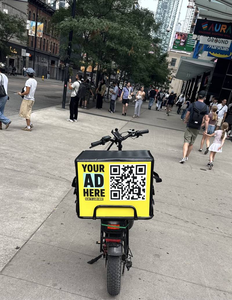 E-bike delivery bag with an advertising panel in downtown Toronto