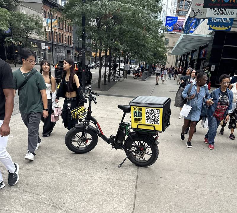 E-bike delivery bag with an advertising panel in downtown Toronto