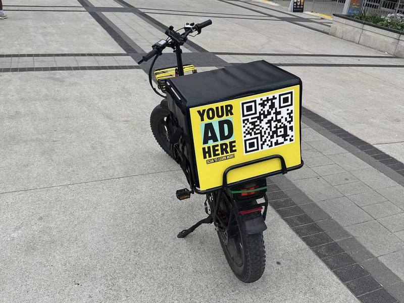 E-bike delivery bag with an advertising panel in downtown Toronto